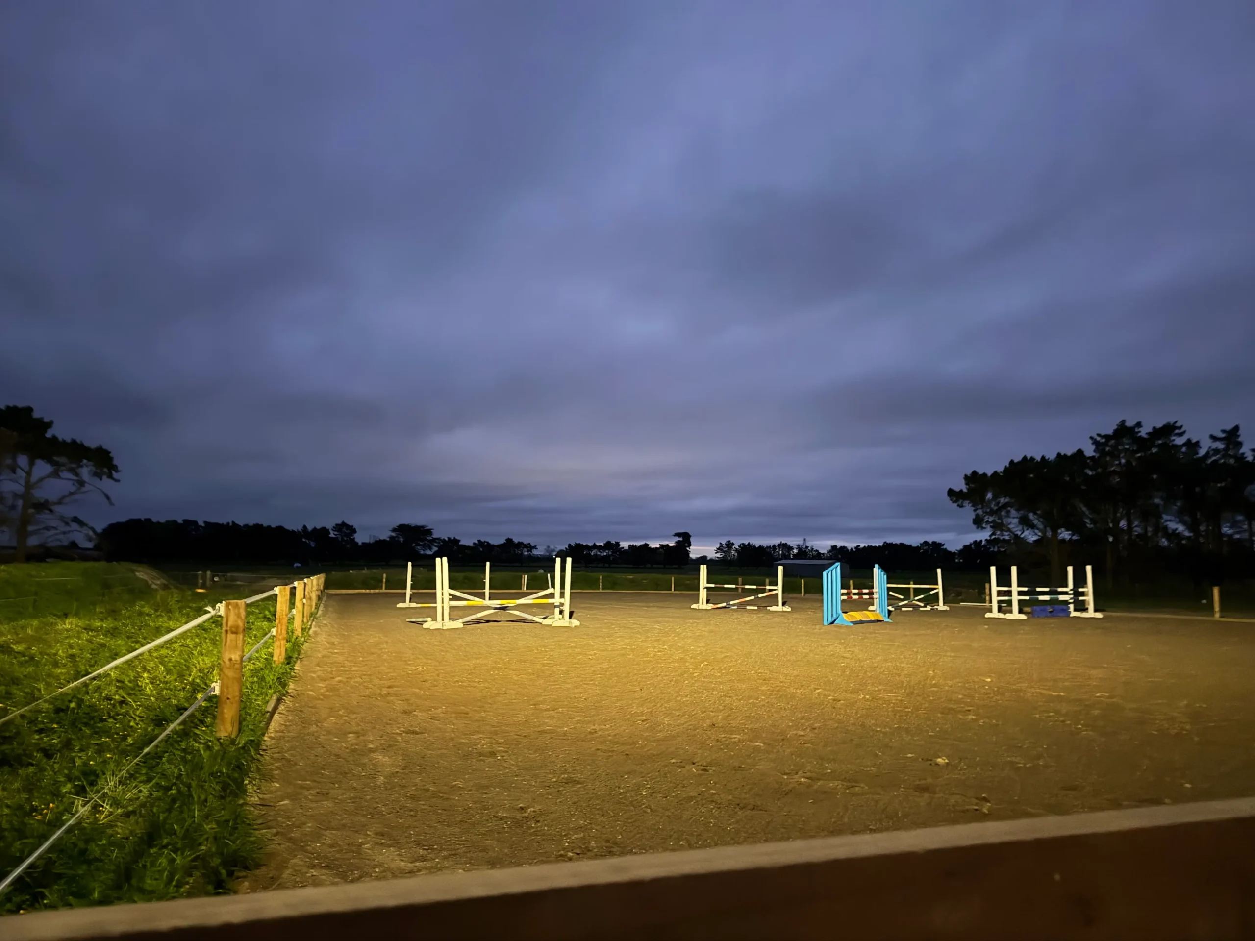 Outdoor riding arena with jumps